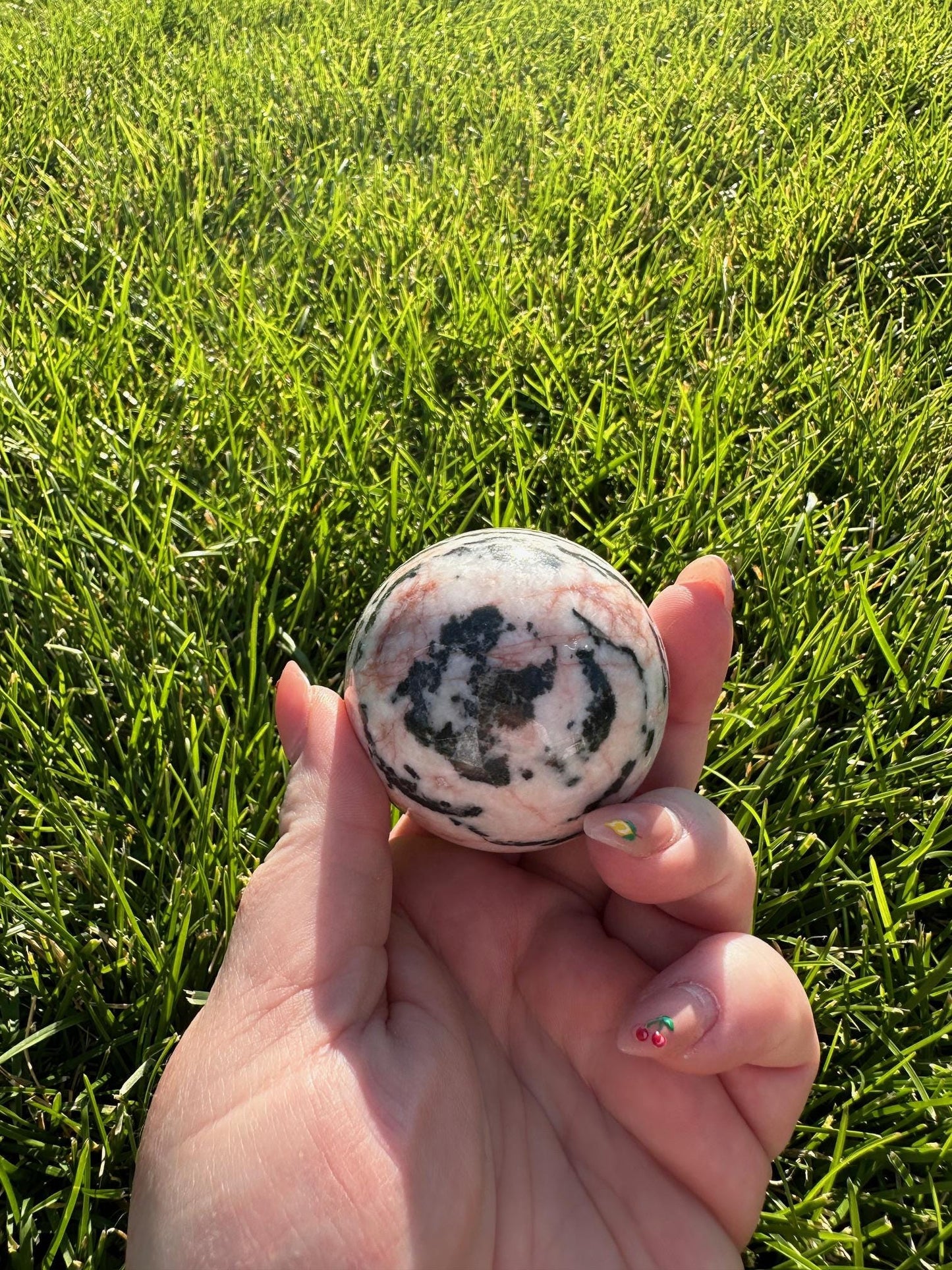 Pink Zebra Jasper Sphere – 1.9" Diameter, 9 oz – Grounding, Balance, and Compassion Crystal