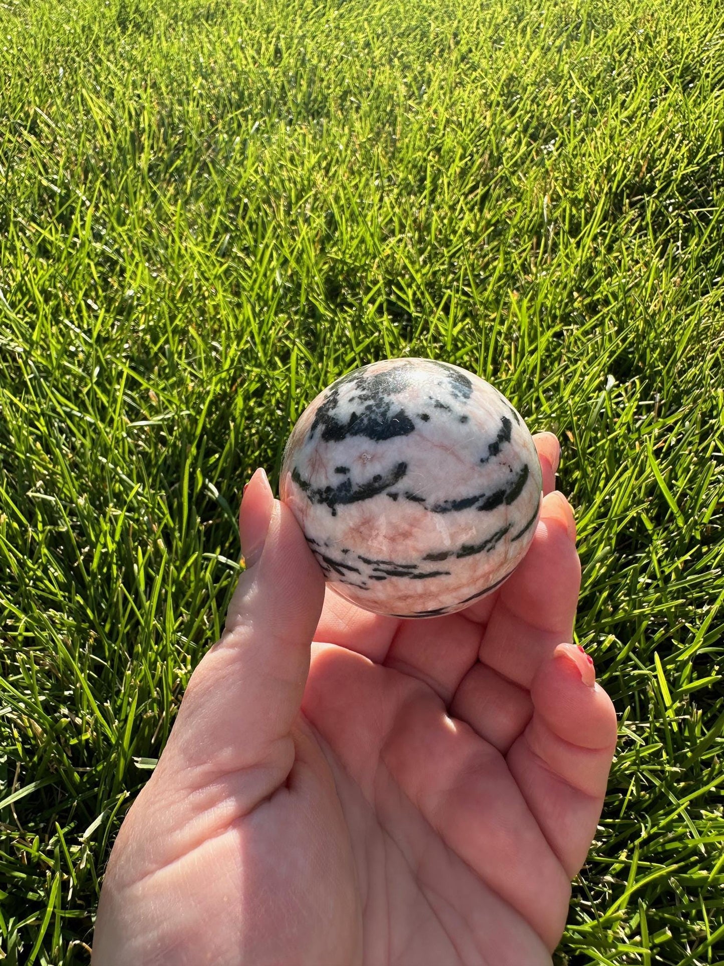 Pink Zebra Jasper Sphere – 1.9" Diameter, 9 oz – Grounding, Balance, and Compassion Crystal